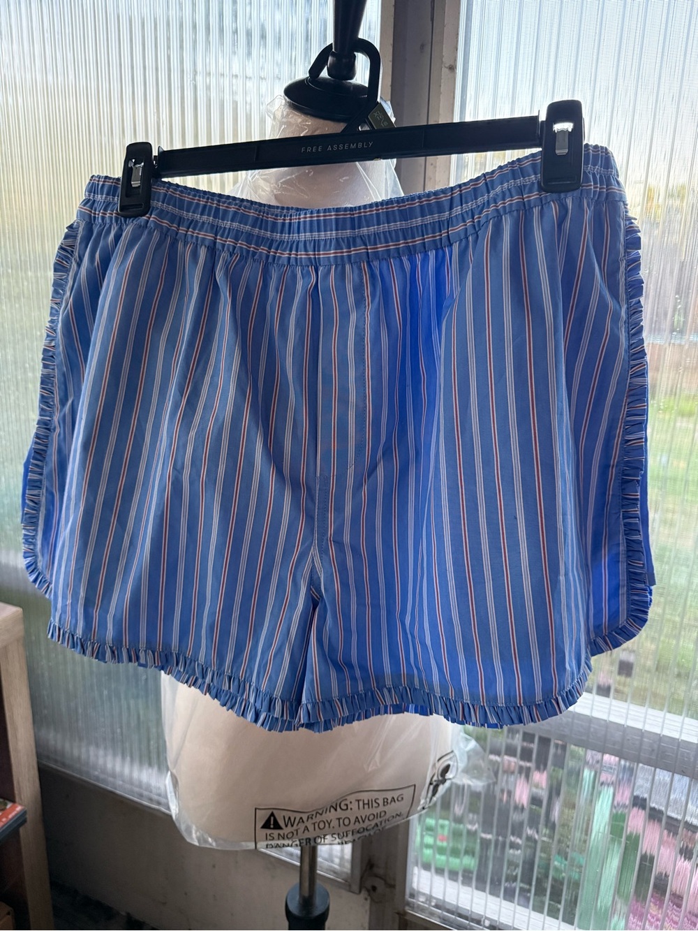 Blue Striped Athletic Shorts with Elastic Waist and Ruffle Hem